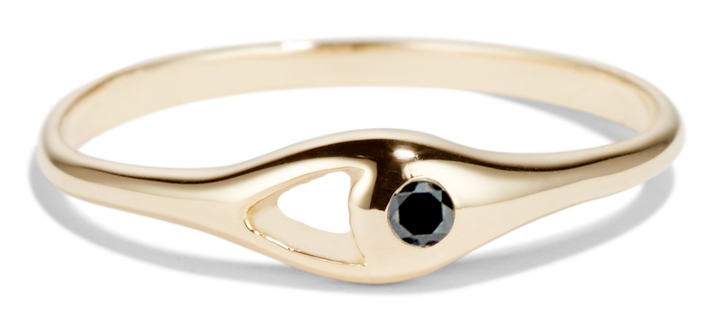 This ring showcases a black diamond set next to an open space.