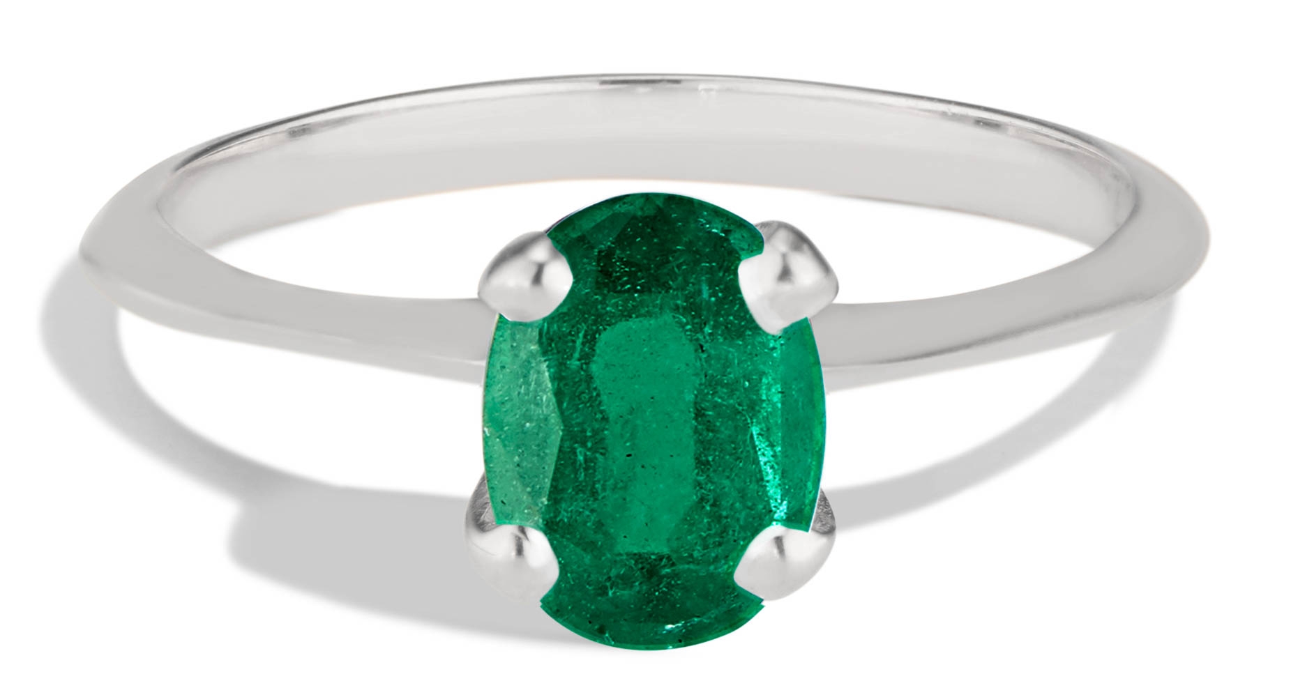 cz ring in platinum with oval cut emerald -