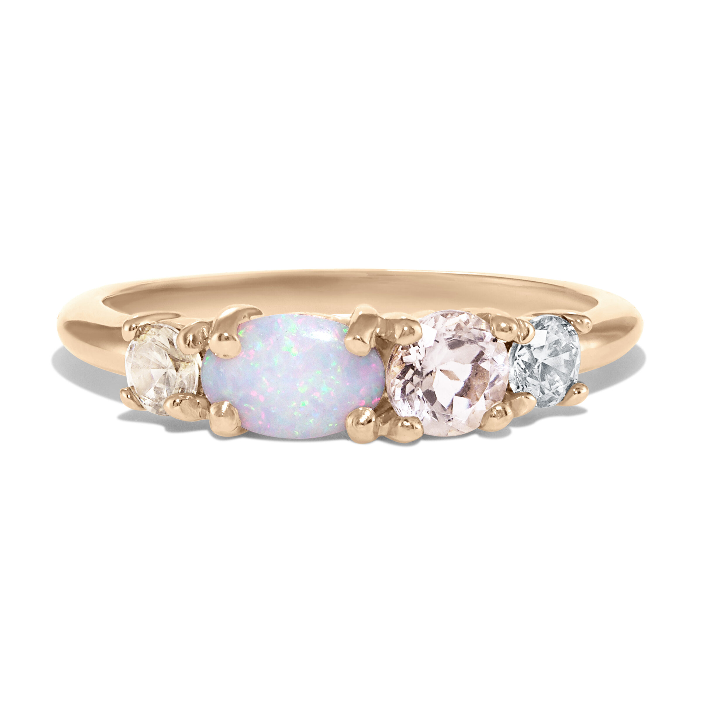 This ring glistens with a line of morganite, champagne diamond, opal, and diamond.