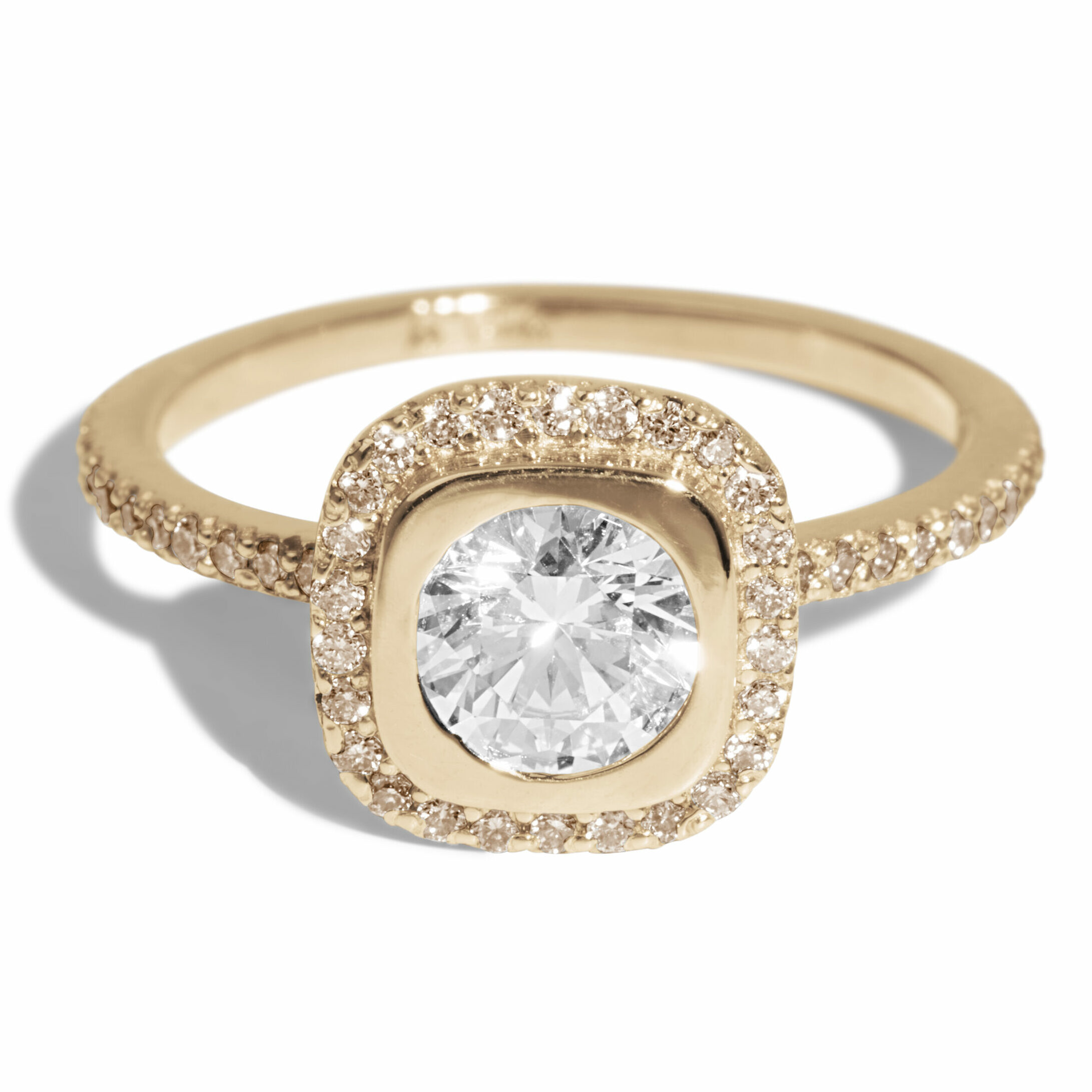 This contemporary take on a halo ring features a diamond center stone with a champagne diamond halo.