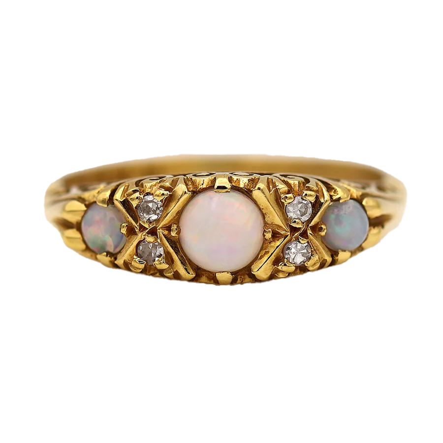 The Santa Fe ring is an authentic Victorian opal wedding ring circa 1900's. This ring features three (3) natural pastel cabochon opals and four (4) single cut diamond accents.