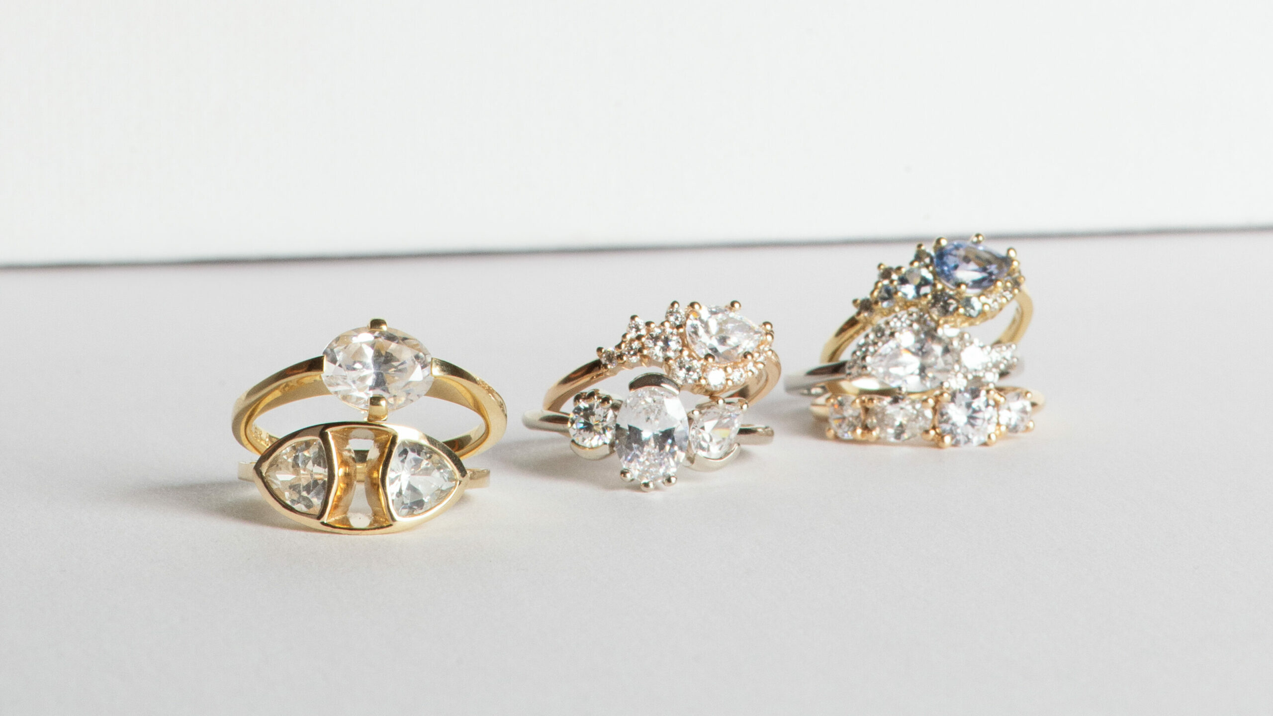 3 stacks of diamond and gemstone rings